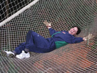 Debbie fallen into net on the last course (where you don't use harnesses)