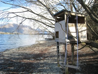 A cubby house on the shores of Lake Wakatipu